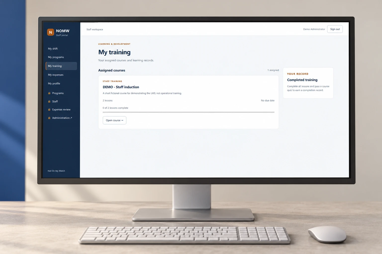 NOMW staff portal presented on a desktop monitor